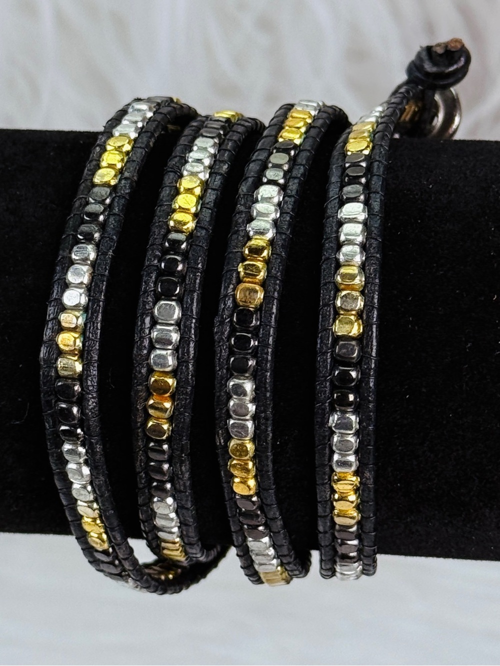 Beautiful black, silvertone and goldtone layering wrap bracelet